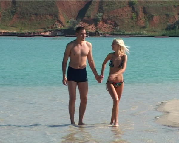 woman and man run on water