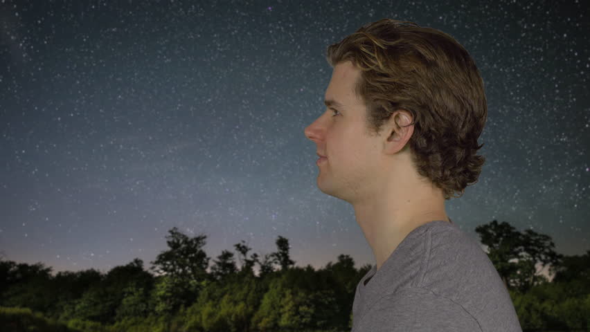 A man looking at the stars in the universe