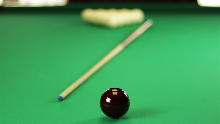 Billiard balls on the table with the cue