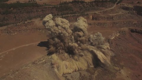 Aerial. Powerful explosion on the open pit mine. Extreme drone shot. 4K