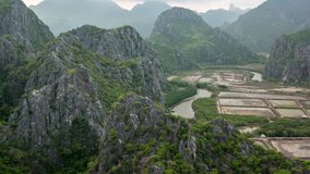 Aerial view of beautiful mountains in Khao Sam Roi Yot National Park, Thailand. Timelapse video with tilt up motion.