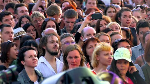 MINSK, BELARUS - JUN 6, 2015: Crowd at a concert. A crowd of people listening to a music concert in the open air. (av14603c)