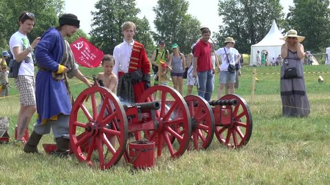 RUSSIA, DUSHONOVO - JULY 3, 2016: Unidentified people in medieval cloth shoot by cannon during history reenaction in Dushonovo village, Moscow region, Russia