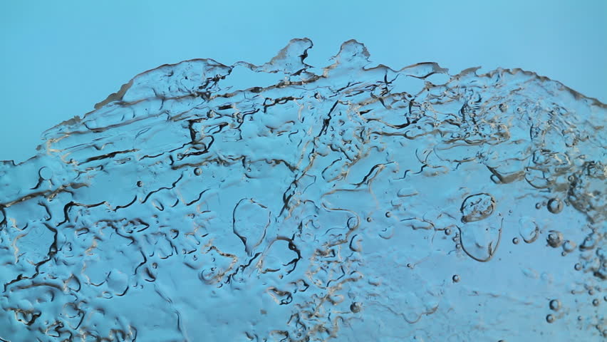 melting ice closeup on blue background