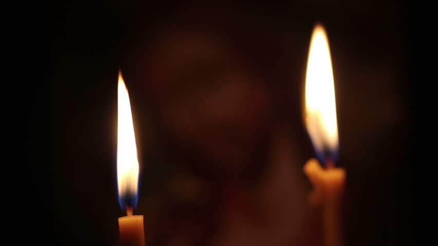 Candles are lit in the church. closeup