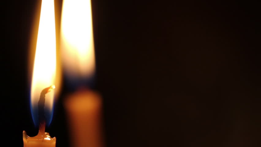 Candles are lit in the church. closeup
