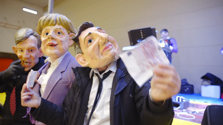 Person with Borut Pahor mask showing 500 Euro banknote 4K. Slovenian carnival with political satire mocking president Borut Pahor, Angela Markel and prime minister Miro Cerar. Royalty-Free Stock Footage #18071038
