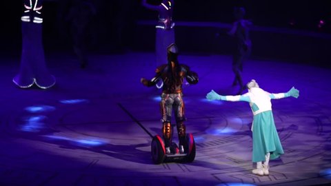 ST. PETERSBURG, RUSSIA - JANUARY 2, 2016: Brothers Zapashny circus, "UFO. Alien Planet Circus" show in Saint Petersburg. Artists in futuristic costumes move on the stage and drive on a segway.