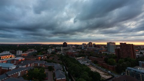 Birmingham sunset time lapse looking towards the University. Filmed from the top floor of the iconic Cube building.