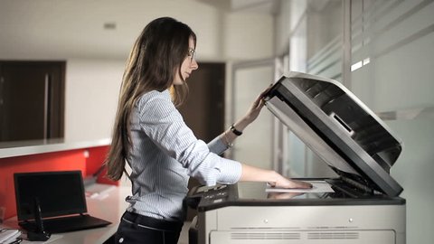 Girl printing in the office