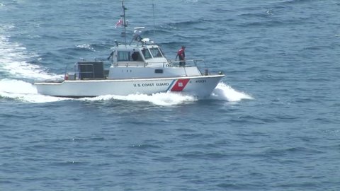 PACIFIC OCEAN CATALINA ISLAND CALIFORNIA - CIRCA: 2007. US Coast Guard patrolling along incoming ship off of Catalina Island California, USA 