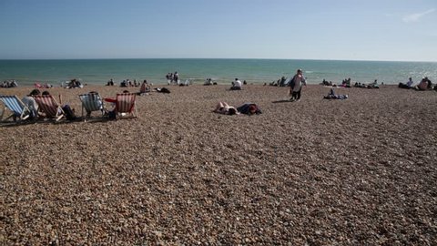 Brighton Beach, England: very hot sunny day