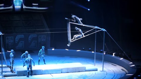 ST. PETERSBURG, RUSSIA - JANUARY 2, 2016: Brothers Zapashny circus, "UFO. Alien Planet Circus" show in Saint Petersburg. Perfomans of aliens with big swings, jumping and doing summersault