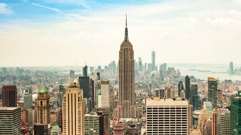 New York City, United States - July 7, 2016: Time lapse view of New York City skyline including the Empire State Building and Freedom Tower in Manhattan, New York, United States - zoom out.