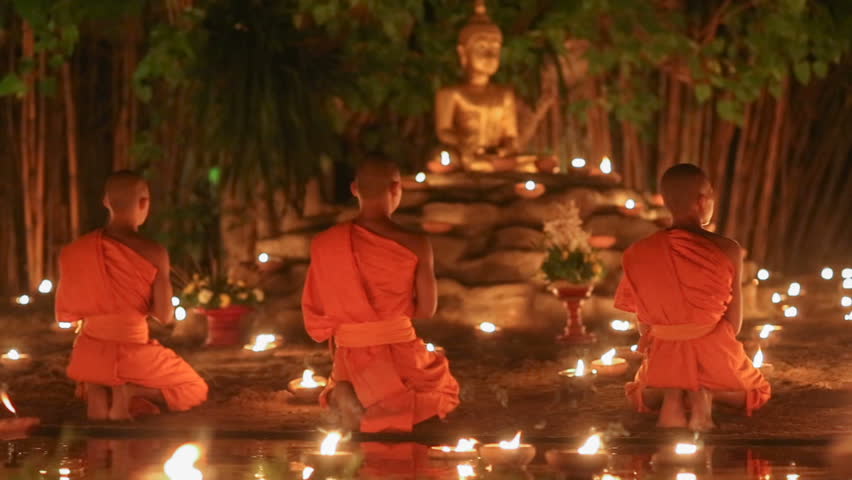 asalha puja day monks light candles Stock Footage Video (100% Royalty ...