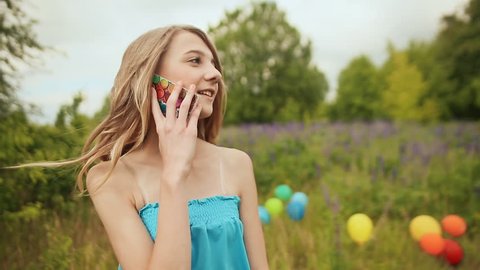 Young teen girl talking on the phone