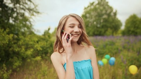 Young teen girl talking on the phone