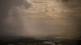 Rain curtaining a view of the mountains.Rain storm over rice fields with curtain of rain - Powered by Shutterstock - Get 15% off with code: PIKWIZARD15