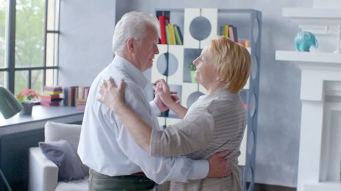 Active retirement and leisure activities, happy dance of an elderly couple