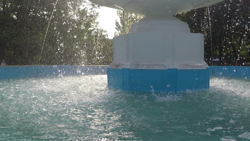 splash fountain close-up slow motion, water droplets back-light