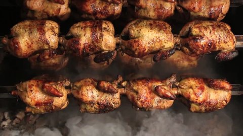 Roasted chicken grilled on fire, barbeque. In South America called "pollo a la brasa"