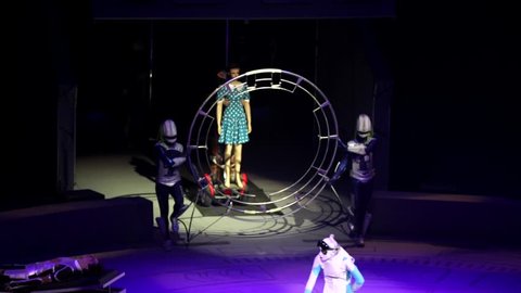 ST. PETERSBURG, RUSSIA - JANUARY 2, 2016: Brothers Zapashny circus, "UFO. Alien Planet Circus" show in Saint Petersburg. Two aliens roll a human on the stretcher, other aliens appear with big wheel