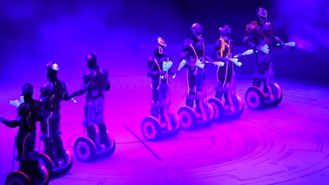 ST. PETERSBURG, RUSSIA - JANUARY 2, 2016: Brothers Zapashny circus, "UFO. Alien Planet Circus" show in Saint Petersburg. Alien jugglers on segways juggle in the dark.