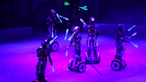 ST. PETERSBURG, RUSSIA - JANUARY 2, 2016: Brothers Zapashny circus, "UFO. Alien Planet Circus" show in Saint Petersburg. Alien jugglers drive on segways and juggle in the dark.