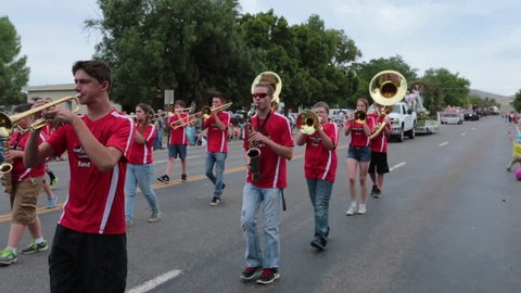 FOUNTAIN GREEN, UTAH - JUL 2016: High School marching band rural town parade. Fourth of July, American celebration for freedom rural town. Parade reflects community values family morals.
