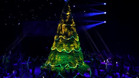 ST. PETERSBURG, RUSSIA - JANUARY 2, 2016: Brothers Zapashny circus, "UFO. Alien Planet Circus" show in Saint Petersburg. Beautiful and high christmas tree grows on the stage