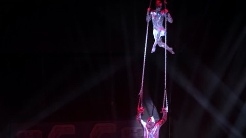 ST. PETERSBURG, RUSSIA - JANUARY 2, 2016: Brothers Zapashny circus, "UFO. Alien Planet Circus" show in Saint Petersburg. Aerial gymnasts ascending on the hawsers.
