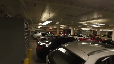 MONTREAL, CANADA - JULY 2016: Luxury Car Dealership Garage - Steadicam Flow