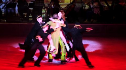 MOSCOW, RUSSIA - JANUARY 12, 2016: Full rehearsal of theater of ice miniatures perfomance anniversary program "We are 30" under direction of I.Bobrin. Vamp woman surrounded with men dance with them