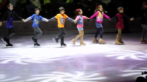 MOSCOW, RUSSIA - JANUARY 12, 2016: Full rehearsal of theater of ice miniatures perfomance anniversary program "We are 30" under direction of Igor Bobrin. Children leave the skating rink.