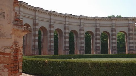Half circle of arches and columns in Palazzo Te garden in Mantua