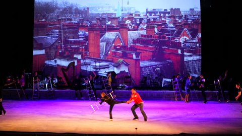 MOSCOW, RUSSIA - JANUARY 12, 2016: Full rehearsal of theater of ice miniatures perfomance anniversary program "We are 30" under direction of I.Bobrin. Artists dance with ladders, jump and spin around.