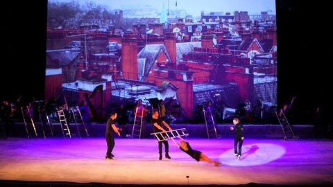 MOSCOW, RUSSIA - JANUARY 12, 2016: Full rehearsal of theater of ice miniatures perfomance anniversary program "We are 30" under direction of I.Bobrin. Group of artists do tricks on ice