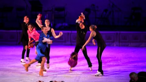 MOSCOW, RUSSIA - JANUARY 12, 2016: Full rehearsal of theater of ice miniatures perfomance anniversary program "We are 30" under direction of I.Bobrin. Ice skaters perform on ice, picking up staff
