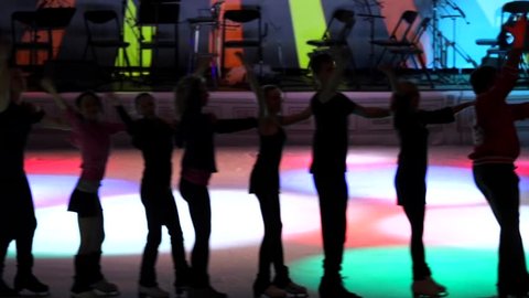 MOSCOW, RUSSIA - JANUARY 12, 2016: Full rehearsal of theater of ice miniatures perfomance anniversary program "We are 30" under direction of I.Bobrin. Conga line of artists glide on ice