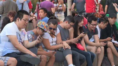 Toronto, Ontario, Canada July 2016 Crowds of people playing Pokemon GO in downtown Toronto