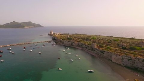 Aerial view from Methoni's Castle in Peloponnese, Greece. The fortress is located by the wonderful sea with rich coloured water. Low angle with forward motion.