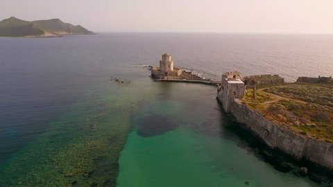 Aerial view from Methoni's Castle in Peloponnese, Greece. The fortress is located by the wonderful sea with rich coloured water. Forward motion.