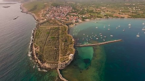 Aerial view from Methoni's Castle in Peloponnese, Greece. The fortress is located by the wonderful sea with rich coloured water. Forward motion. 