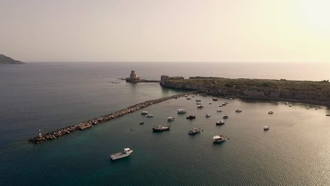 Aerial view from Methoni's Castle in Peloponnese, Greece. The fortress is located by the wonderful sea with rich coloured water. Low angle panning sideways.
