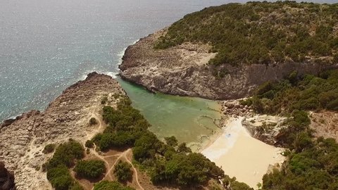 Aerial view from Glossa beach in Peloponnese, Greece. A small triangle-shaped gulf, very close to the popular Voidokilia beach. Forward motion.