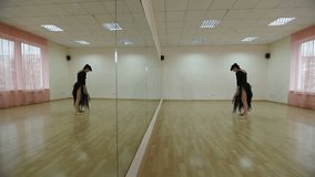 female dancer practiced in front of the mirror