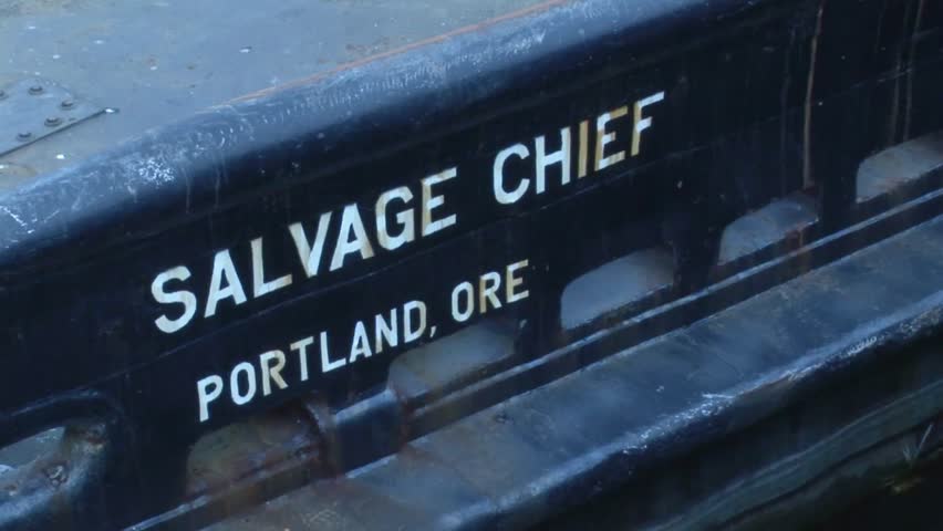 Tug SALVAGE CHIEF sign on side of vessel built in Houston in the mid 1940s a famous former marine salvage vessel Swan Island industrial district Portland Oregon USA