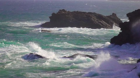 Seascape waves crushing on rocky ocean sea shore slow motion.