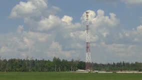 Time lapse footage with cellular tower and clouds moving fast