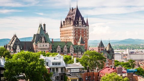 Quebec City, Canada, time lapse view of the famous Chateau Frontenac castle overlooking the Old Port of Quebec - zoom out.